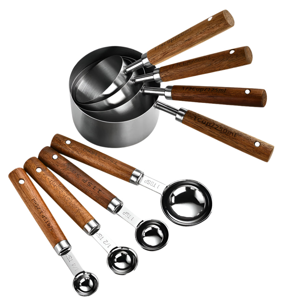 Set of eight measuring cups and spoons with wooden handles on a white background
